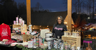 KhryssyLLC owner Khrystina at a vendor market displaying custom apparel and drinkware built from her dream business in Greenville SC