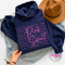 Navy hoodie with the brave strong warrior Pink Spirit graphic in white