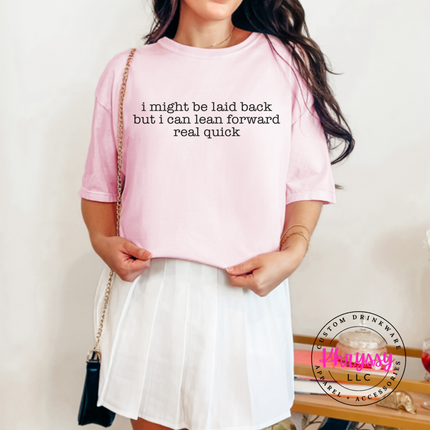 Blossom tee with charcoal typewriter quote about being laid back but leaning forward.