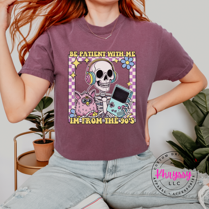 Close up of the retro skeleton art on a Berry tee.