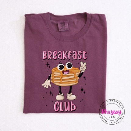Model wearing the Breakfast Club Pancake pancake stack tee in Berry.