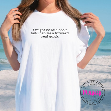 White tee with black typewriter quote about being laid back but leaning forward.