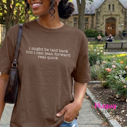 Espresso tee with white typewriter quote about being laid back but leaning forward.