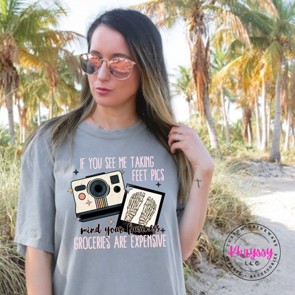 Grey tee with a retro camera and skeleton feet humor graphic in pink