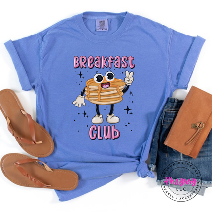 Flo Blue tee featuring a retro pancake stack with tiny legs and Breakfast Club lettering.