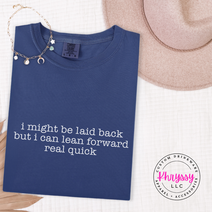 Navy tee with white typewriter quote about being laid back but leaning forward.