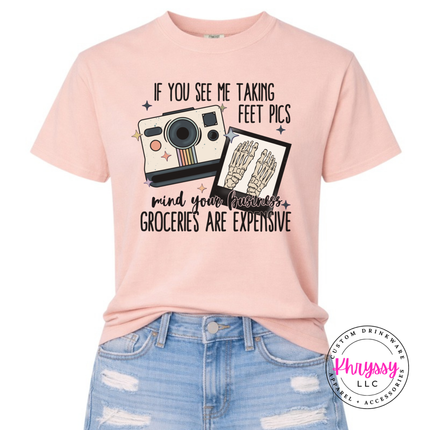 Peachy tee with a retro camera and skeleton feet pics groceries joke