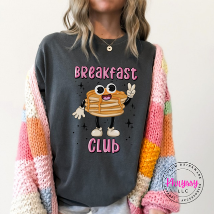 Pepper tee showing a cartoon pancake stack under bold outlined Breakfast Club text.