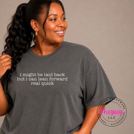 Pepper tee with white typewriter quote about being laid back but leaning forward.