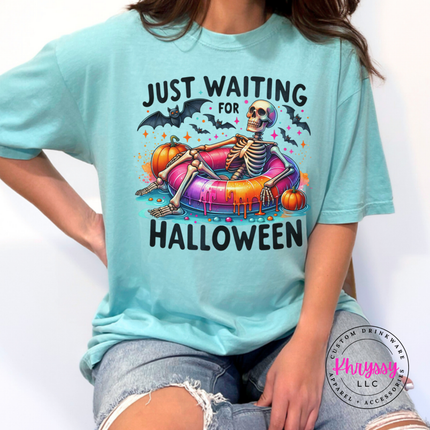 Chalky Mint tee with a skeleton lounging on a pool float Halloween design