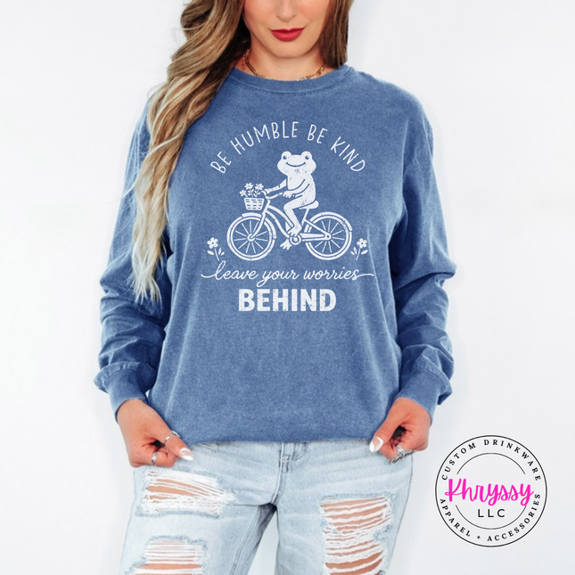 Close up of the frog on a bike art on a Blue Jean long sleeve.