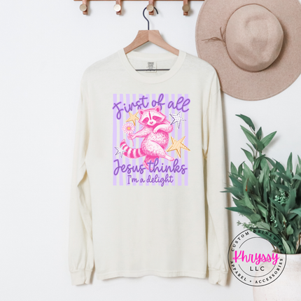 Ivory long sleeve tee with a pink raccoon, daisy and a playful faith quote