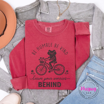Crimson long sleeve tee showing a vintage-style frog on a bike with a kindness message.