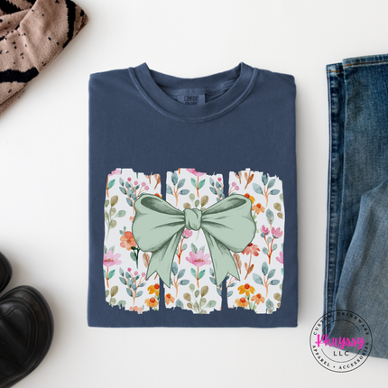 Denim long sleeve tee with a sage green bow over watercolor wildflower panels.