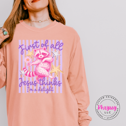 Peachy long sleeve tee with a striped raccoon graphic and a faith humor message