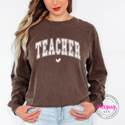 Woman wearing an Espresso long sleeve tee with vintage Teacher varsity lettering.