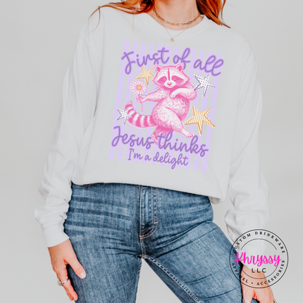 White long sleeve tee showing a pink raccoon holding a daisy with faith text