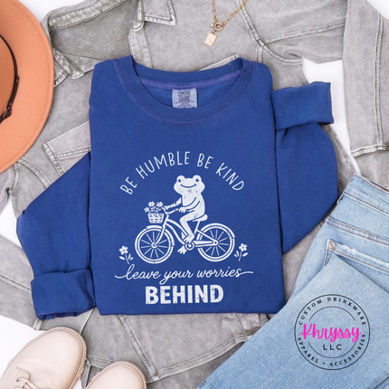 Close up of the frog on a bike art on a Navy long sleeve tee.