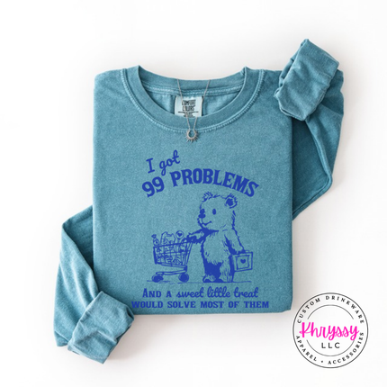Close up of the treat bear art on a Ice Blue long sleeve tee.