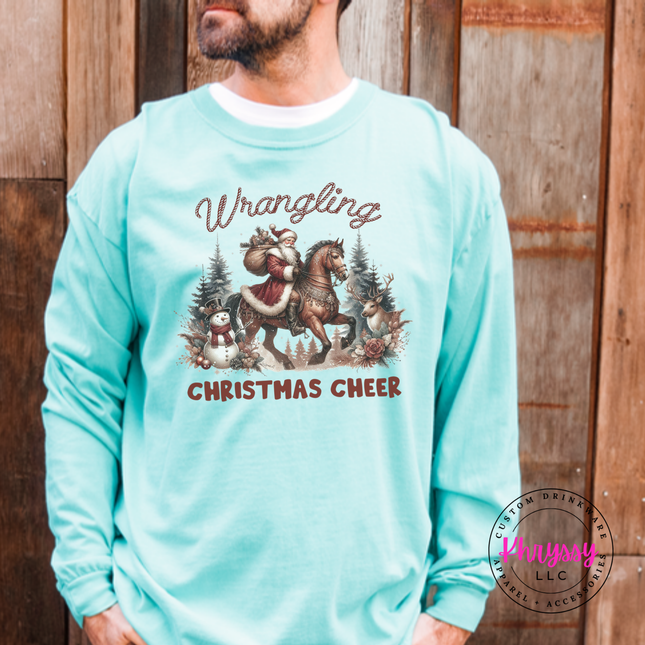 Wrangling Christmas Cheer long sleeve tee in Chalky Mint featuring Santa on horseback.