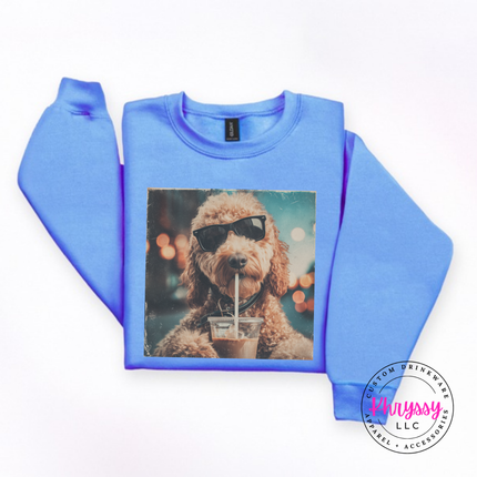 Carolina Blue crewneck sweatshirt with a retro goldendoodle in sunglasses sipping iced coffee print.
