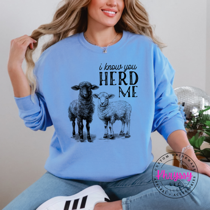 Carolina Blue crewneck sweatshirt with two sheep and the words i know you herd me