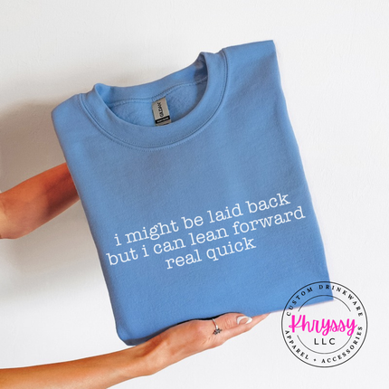 Carolina Blue crewneck sweatshirt with white typewriter quote about being laid back but leaning forward.