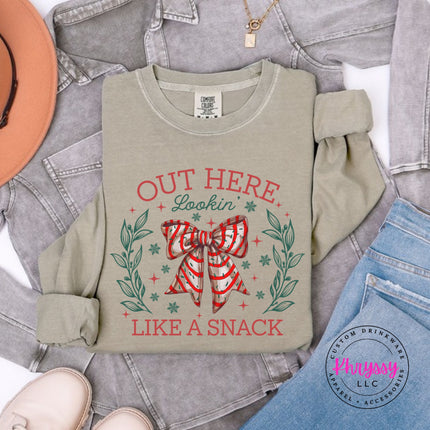 Khaki long sleeve tee with the Lookin Like A Snack candy cane bow.