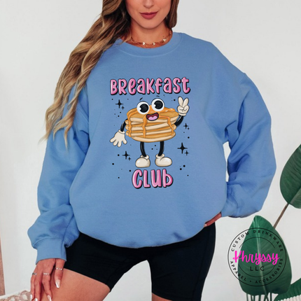 Model wearing the Breakfast Club Pancake pancake stack crewneck sweatshirt in Carolina Blue.