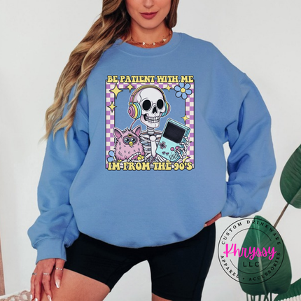 Close up of the retro skeleton art on a Carolina Blue crewneck sweatshirt.
