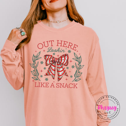 Peachy long sleeve tee with the Lookin Like A Snack candy cane bow.