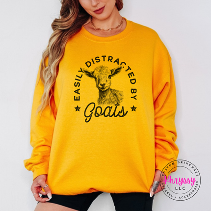 Gold crewneck sweatshirt with Easily Distracted by Goats print and sketched baby goat.