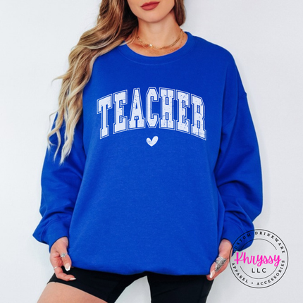 Woman wearing a Royal crewneck sweatshirt with vintage Teacher varsity lettering.