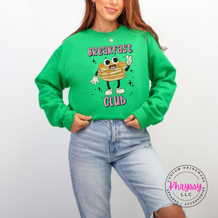 Irish Green crewneck sweatshirt showing a cartoon pancake stack under bold outlined Breakfast Club text.