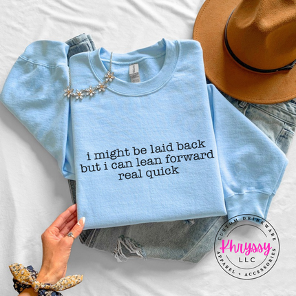 Light Blue crewneck sweatshirt with black typewriter quote about being laid back but leaning forward.