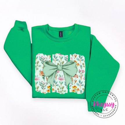 Irish Green crewneck sweatshirt with a sage green bow over watercolor wildflower panels