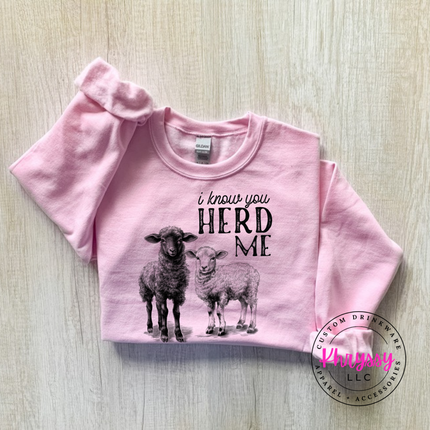 Light Pink crewneck sweatshirt with two sheep and the words i know you herd me