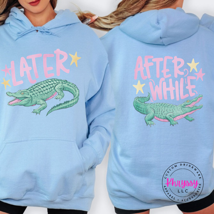 Light Blue hoodie with a retro pastel Later alligator print on the front