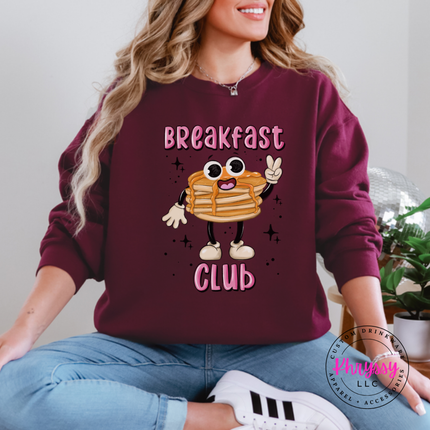 Maroon crewneck sweatshirt featuring a retro pancake stack with tiny legs and Breakfast Club lettering.