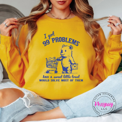 Gold crewneck sweatshirt showing a cute one-color bear and cart sweet little treat design.
