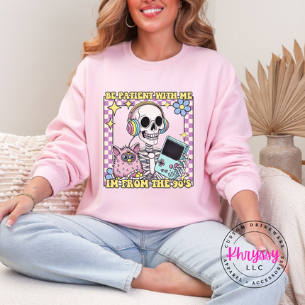 Close up of the retro skeleton art on a Light Pink crewneck sweatshirt.