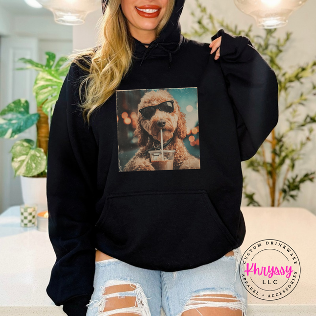Black hoodie with a retro goldendoodle in sunglasses sipping iced coffee print.