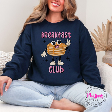 Close up of the pancake stack art on a Navy crewneck sweatshirt.