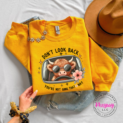 Gold crewneck sweatshirt with a highland cow in sunglasses and Don't Look Back print