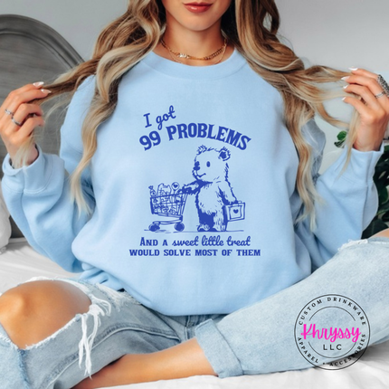 Close up of the treat bear art on a Light Blue crewneck sweatshirt.