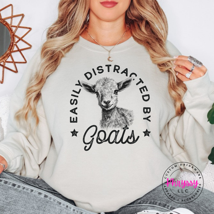 Sand crewneck sweatshirt with Easily Distracted by Goats print and sketched baby goat.