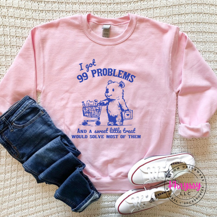 Close up of the treat bear art on a Light Pink crewneck sweatshirt.