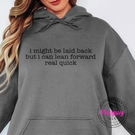 Charcoal hoodie with black typewriter quote about being laid back but leaning forward.