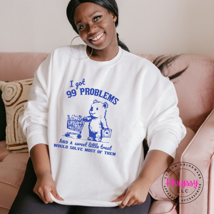 Close up of the treat bear art on a White crewneck sweatshirt.