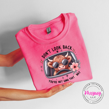 Safety Pink crewneck sweatshirt with a highland cow in sunglasses and Don't Look Back print